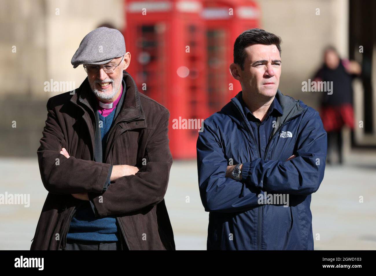 Andy Burnham, Mayor of Greater Manchester and Dr David Walker, Bishop of Manchester, watch a protest Stock Photo