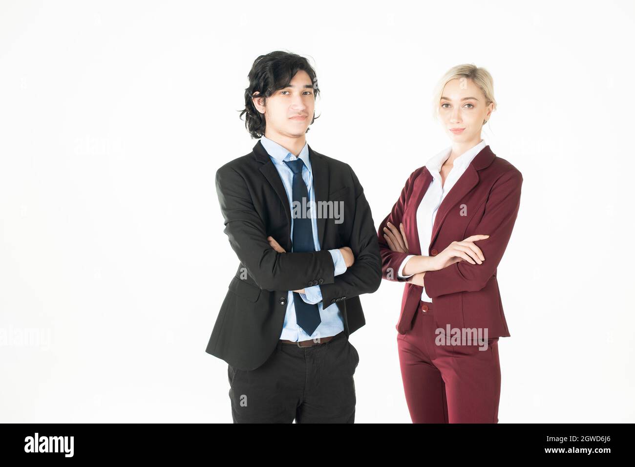 Portrait Of Businessman Standing With Colleague Against White Background Stock Photo