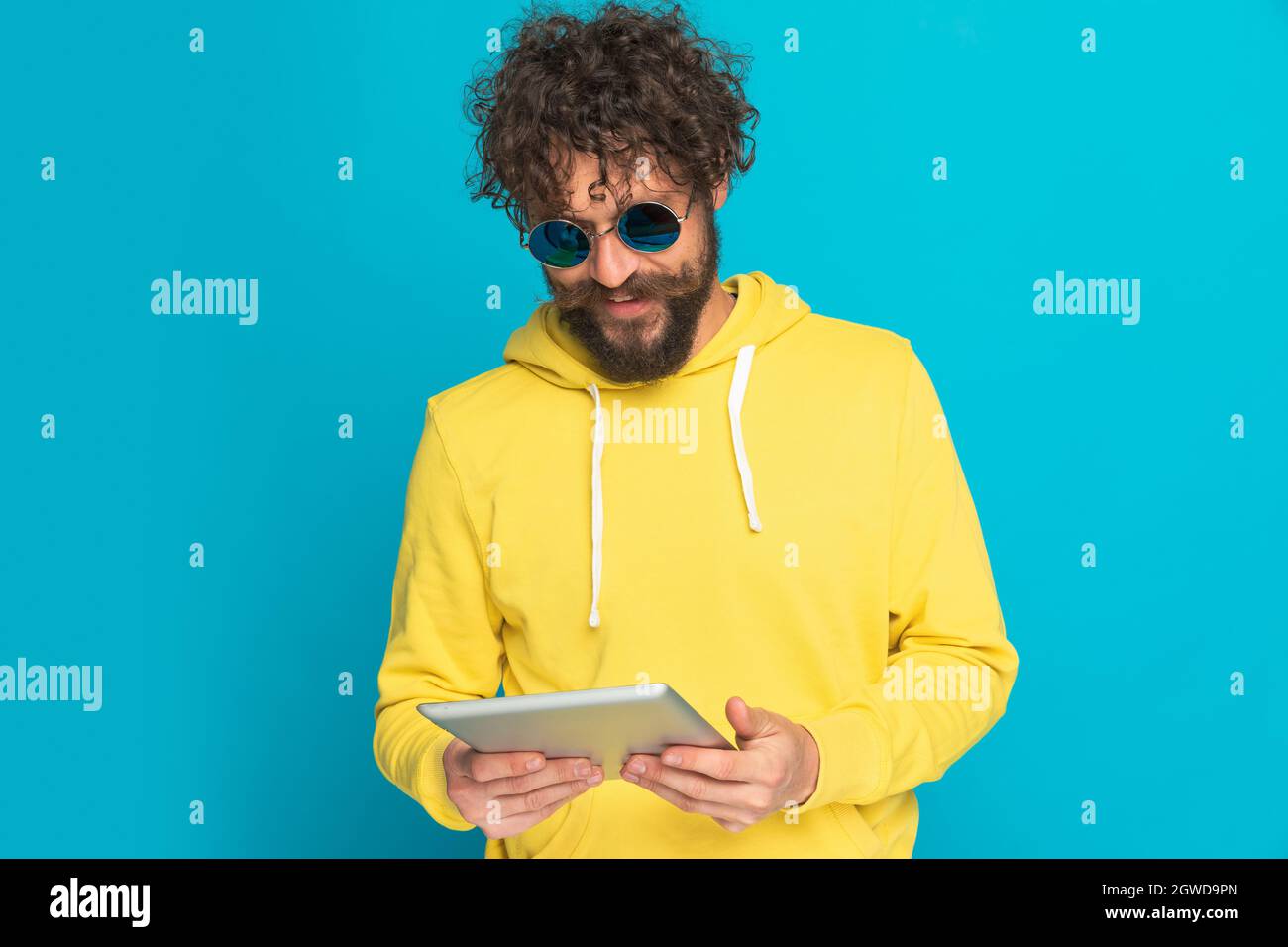 Bearded man with curly hair hi-res stock photography and images - Alamy