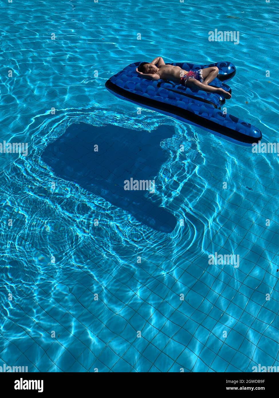 High Angle View Of Man Swimming In Pool Stock Photo