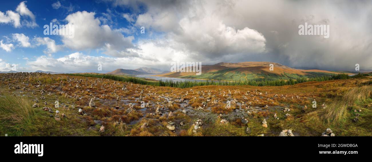 Panorama of stone stacks in the Scottish Highlands, overlooking the Ardochy Forest towards Loch Garry, Scotland, UK Stock Photo