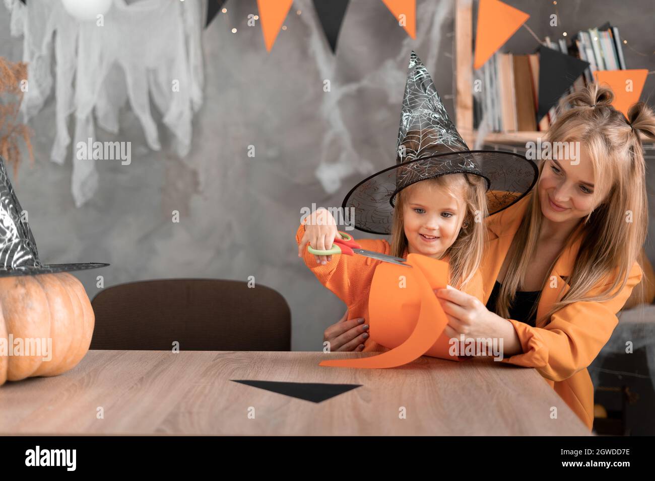 length portrait against a white background of a woman with green body paint  dressed up in a witch costume for Halloween making a scary face at camera  Stock Photo - Alamy