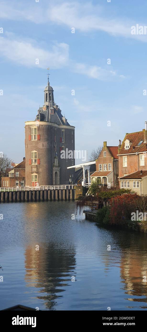 Ancient Tower Reflected In The Water Of The Canal Stock Photo