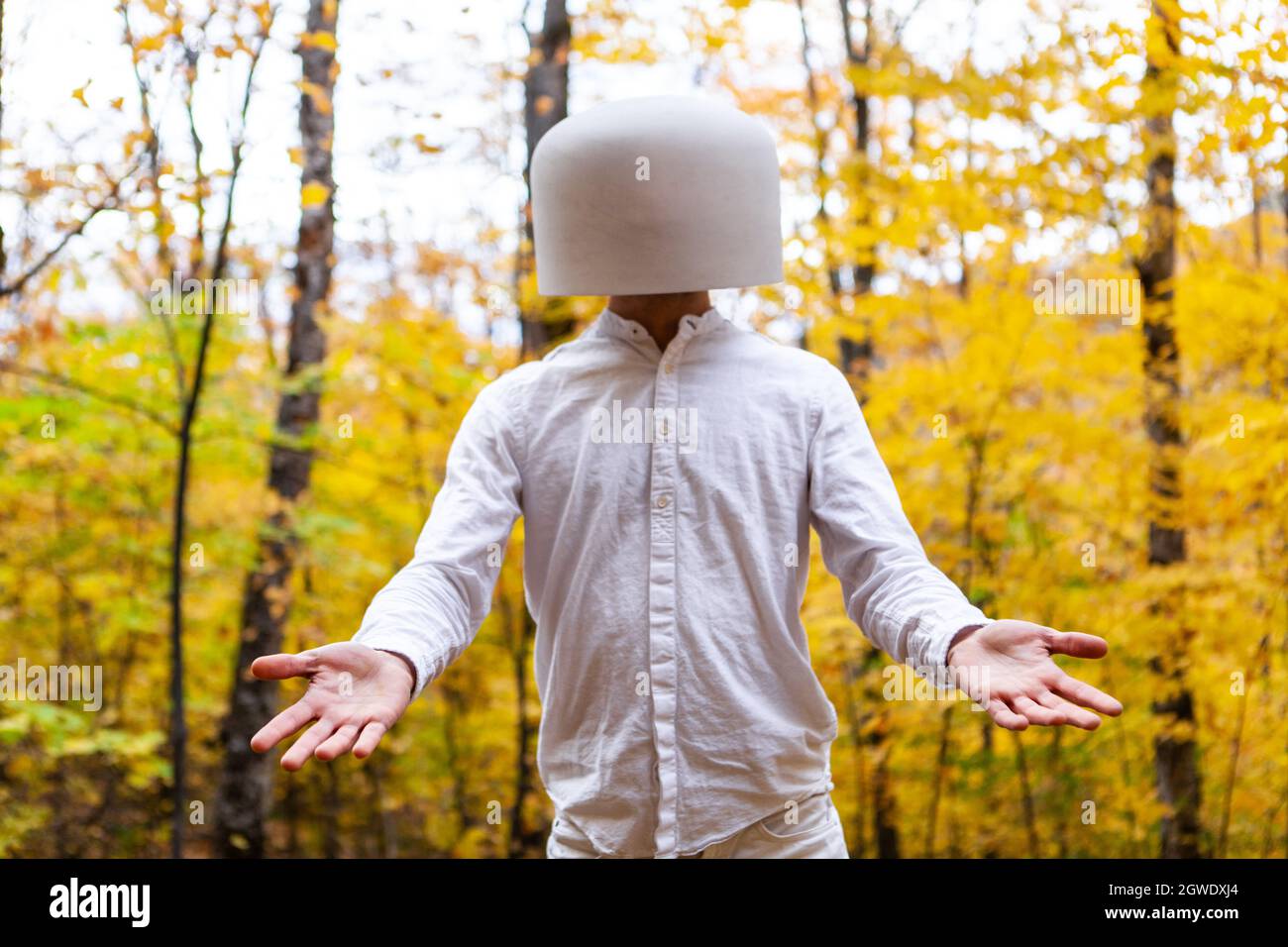 Man Wearing Bowl On Head Against Trees Stock Photo - Alamy
