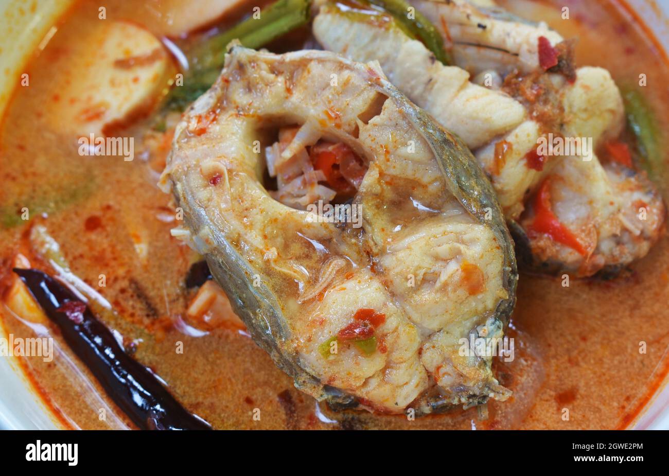 spicy boiled snake head fish meat and slice coconut shoot in tom yum ...