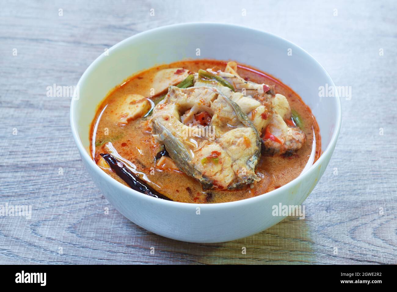 spicy boiled snake head fish meat and slice coconut shoot in tom yum ...