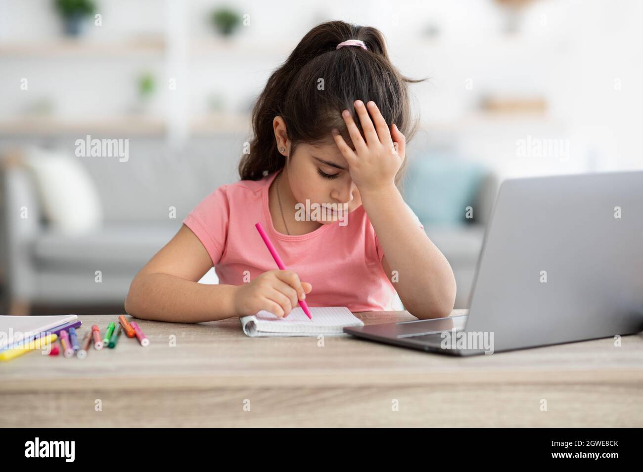 Homeschooling Difficulties. Upset Little Girl Tired Of Doing Homework ...