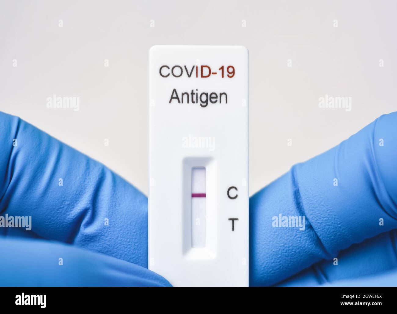Medical personnel showing Covid19 negative test result of the antigen
