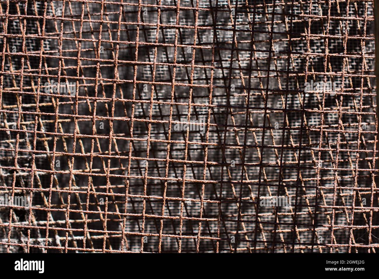 A closeup of a rusted metal wire with sun rays shining on it Stock ...