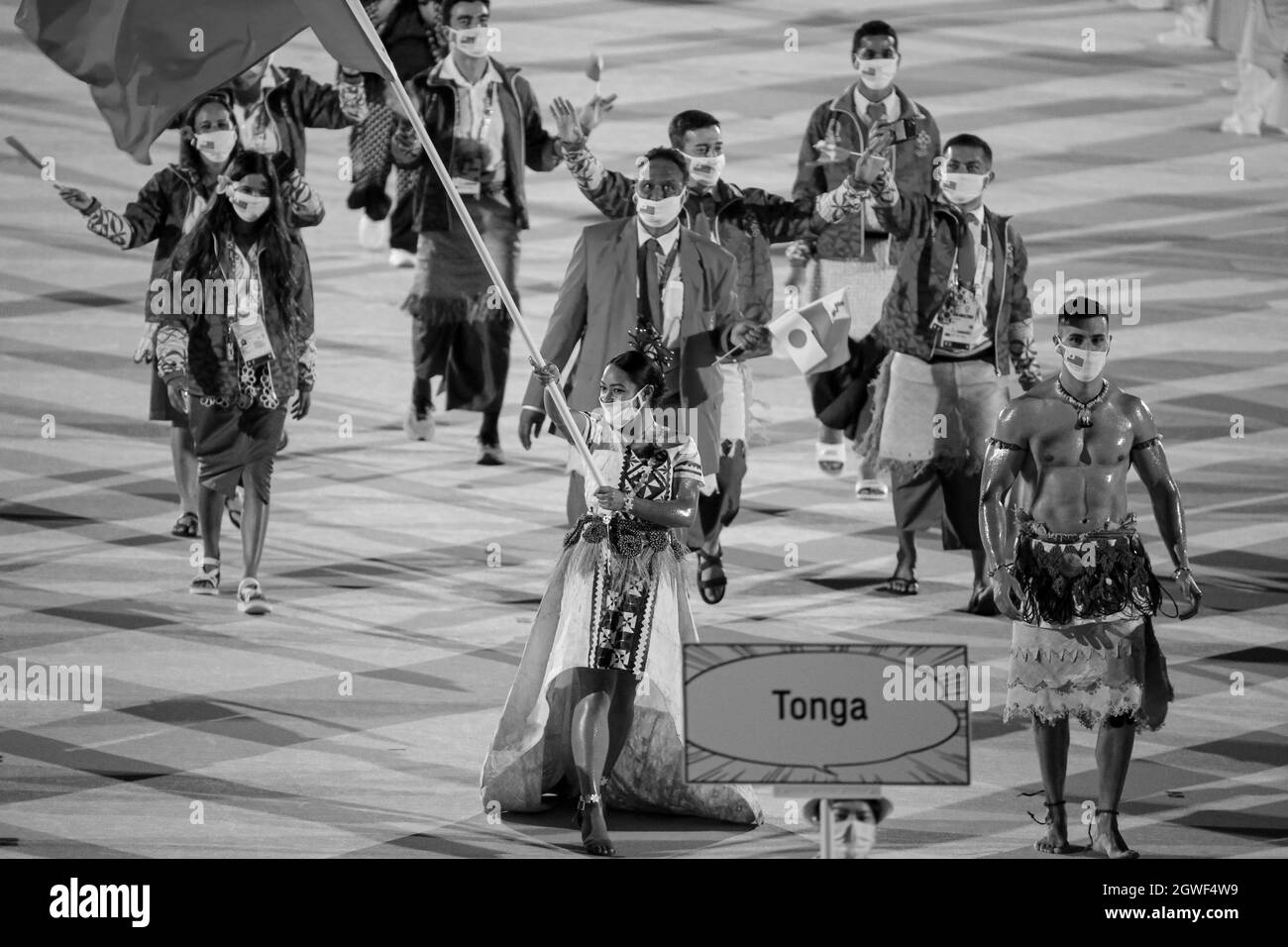 JULY 23rd, 2021 - TOKYO, JAPAN: Tonga's flag bearers Malia Paseka and Pita Taufatofua enter the Olympic Stadium with their delegation during the Parad Stock Photo