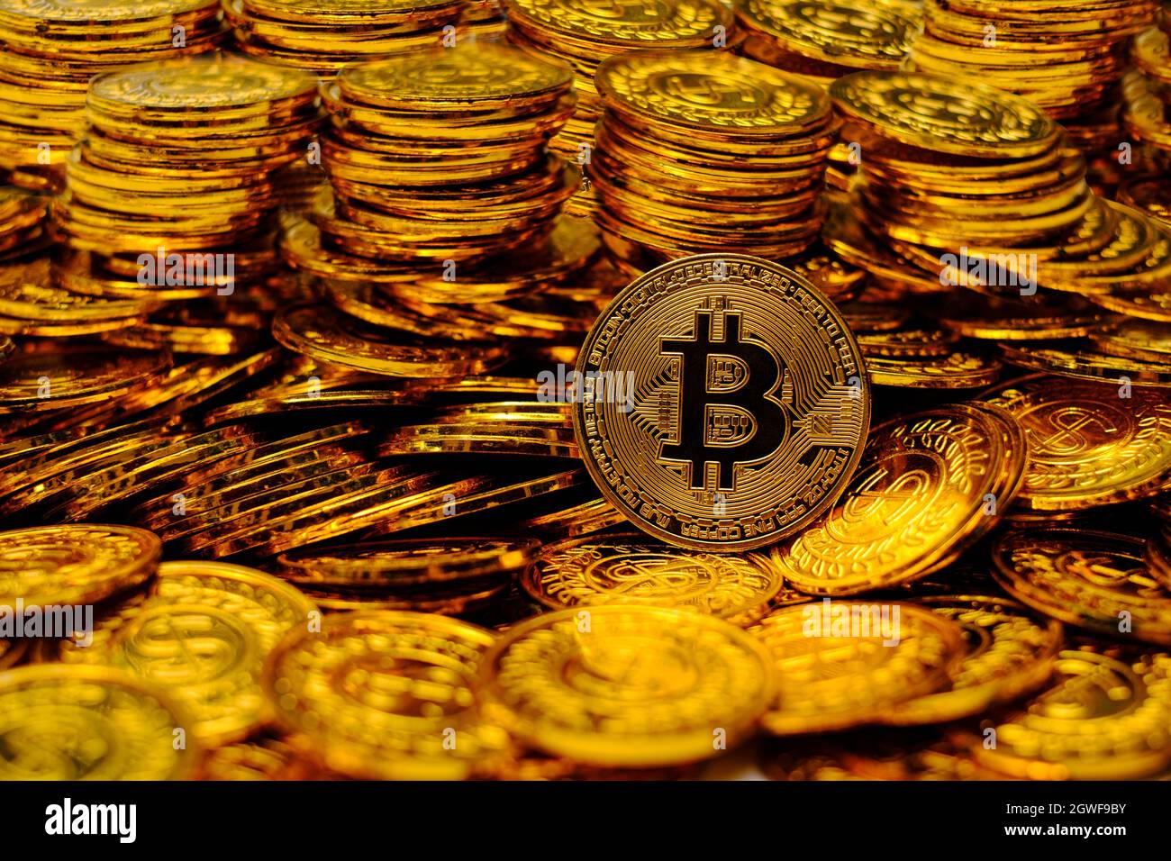 Bitcoin cryptocurrency on pile gold coins a lot of Stock Photo - Alamy