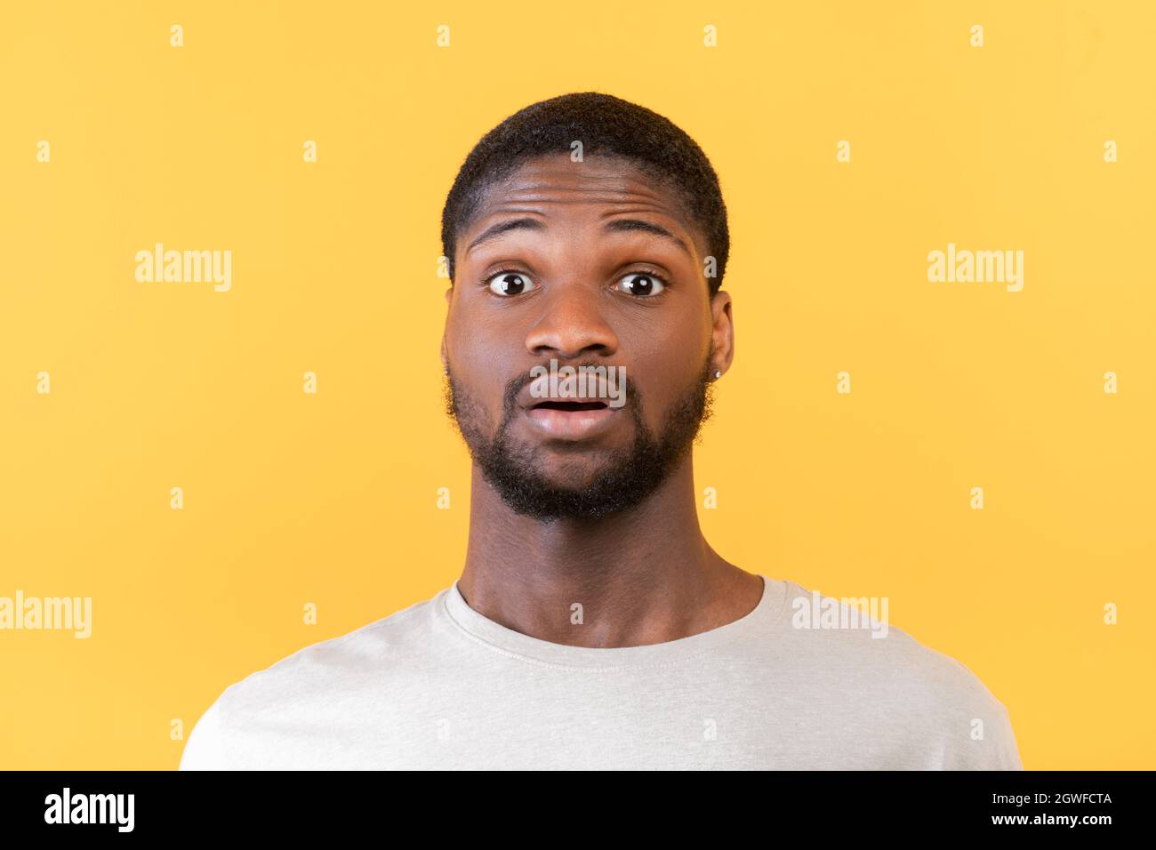 Unbelievable News Portrait Of Surprised Black Guy Opening His Eyes In Shock Looking At Camera On Yellow Background Studio Shot Closeup Stock Photo Alamy