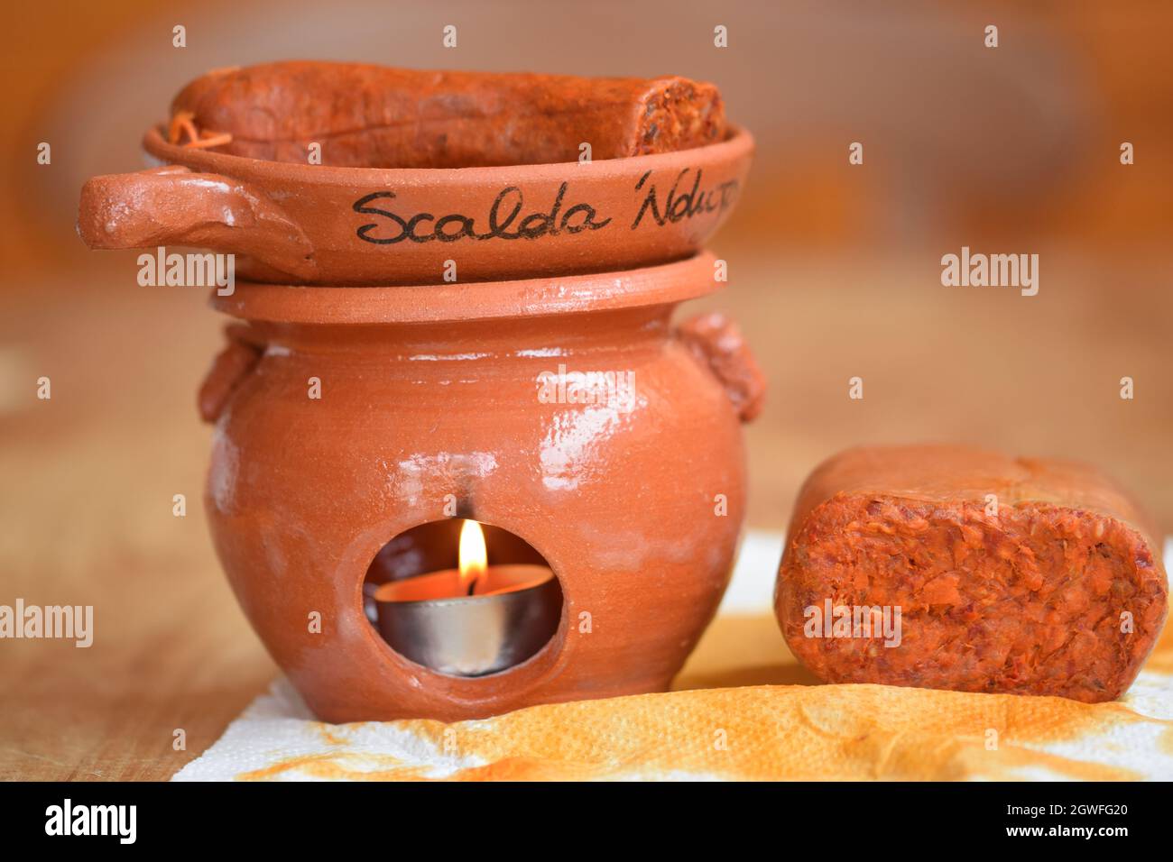 scalda nduja terracotta tool to heat and make the nduja
