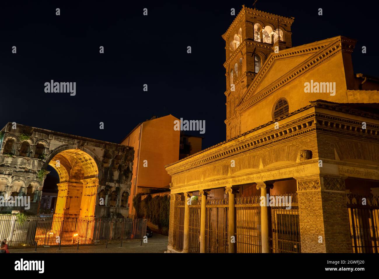 Basilica of San Giorgio in Velabro and Arch of Janus at night in city of Rome, Italy Stock Photo