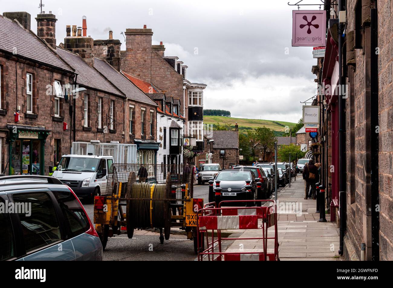 The main street through the small market town of Wooler with many shops