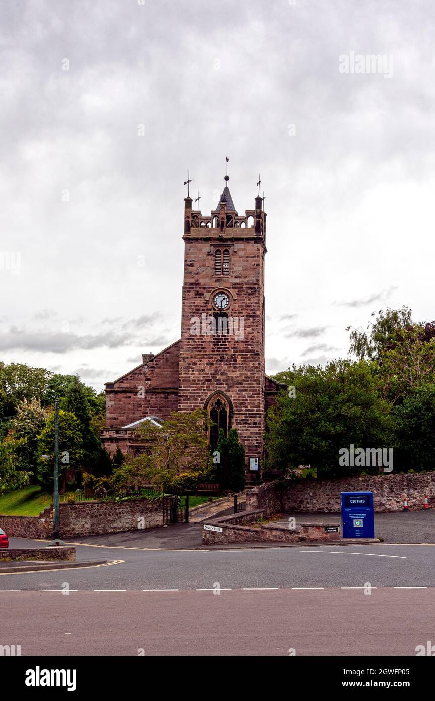The gothicized parish Church of St. Mary in Wooler built in 1765 and enlarged in 1873 has a clock tower embellished with a Tudor-arched balustrade Stock Photo