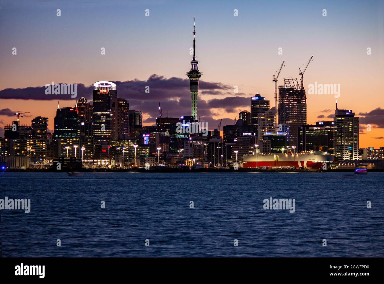 Auckland skyline from Devonport at sunset, New Zealand Stock Photo
