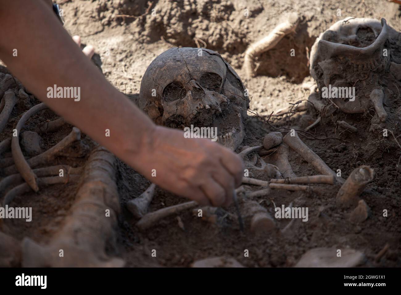 Vinča, Serbia, Sep 4, 2021: Close-up of an archaeologist working on human remains excavation Stock Photo