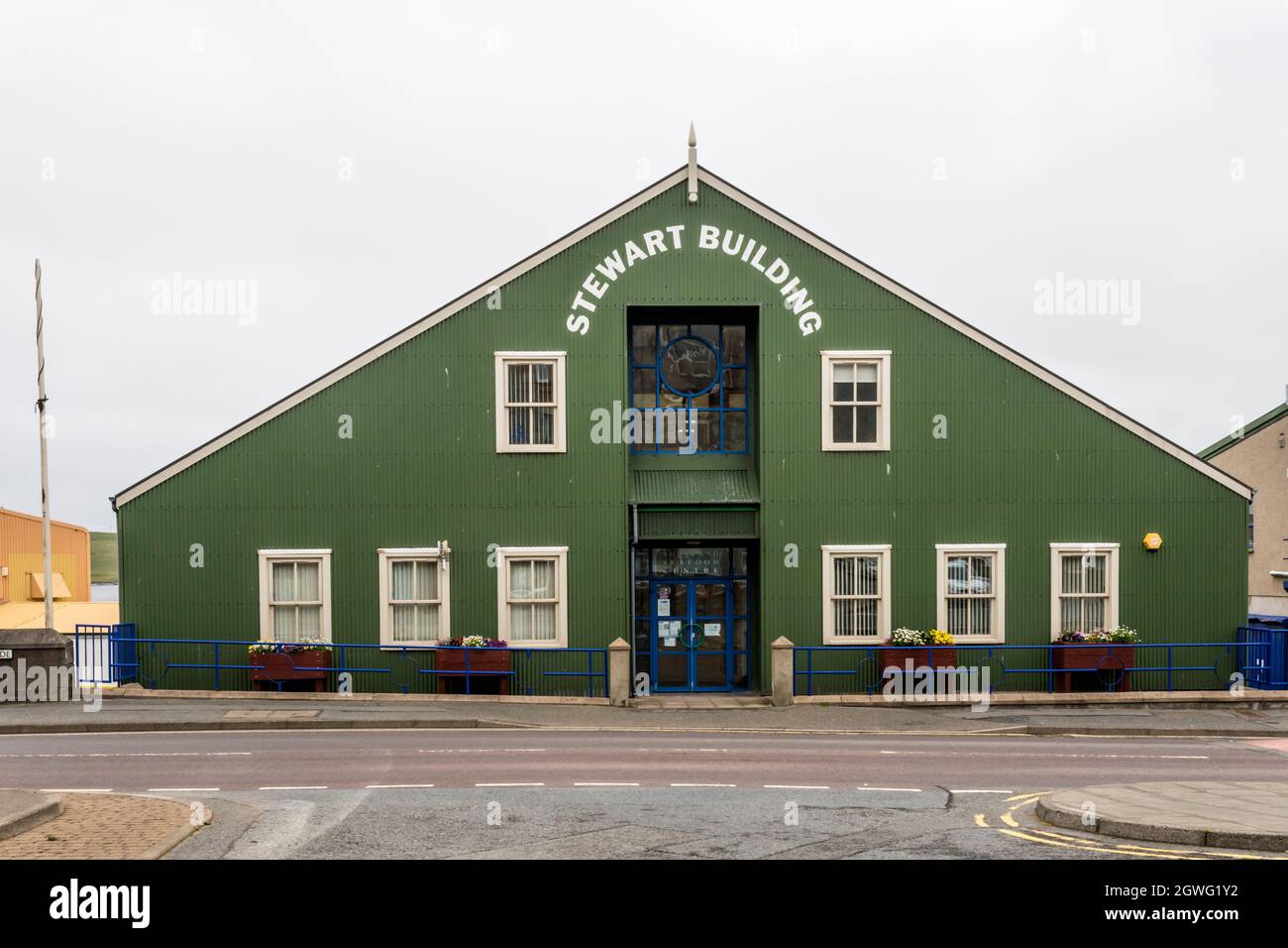 The Stewart Building in Lerwick, designed with green corrugated cladding to reflect the area's character, is the home of the Shetland Seafood Centre. Stock Photo