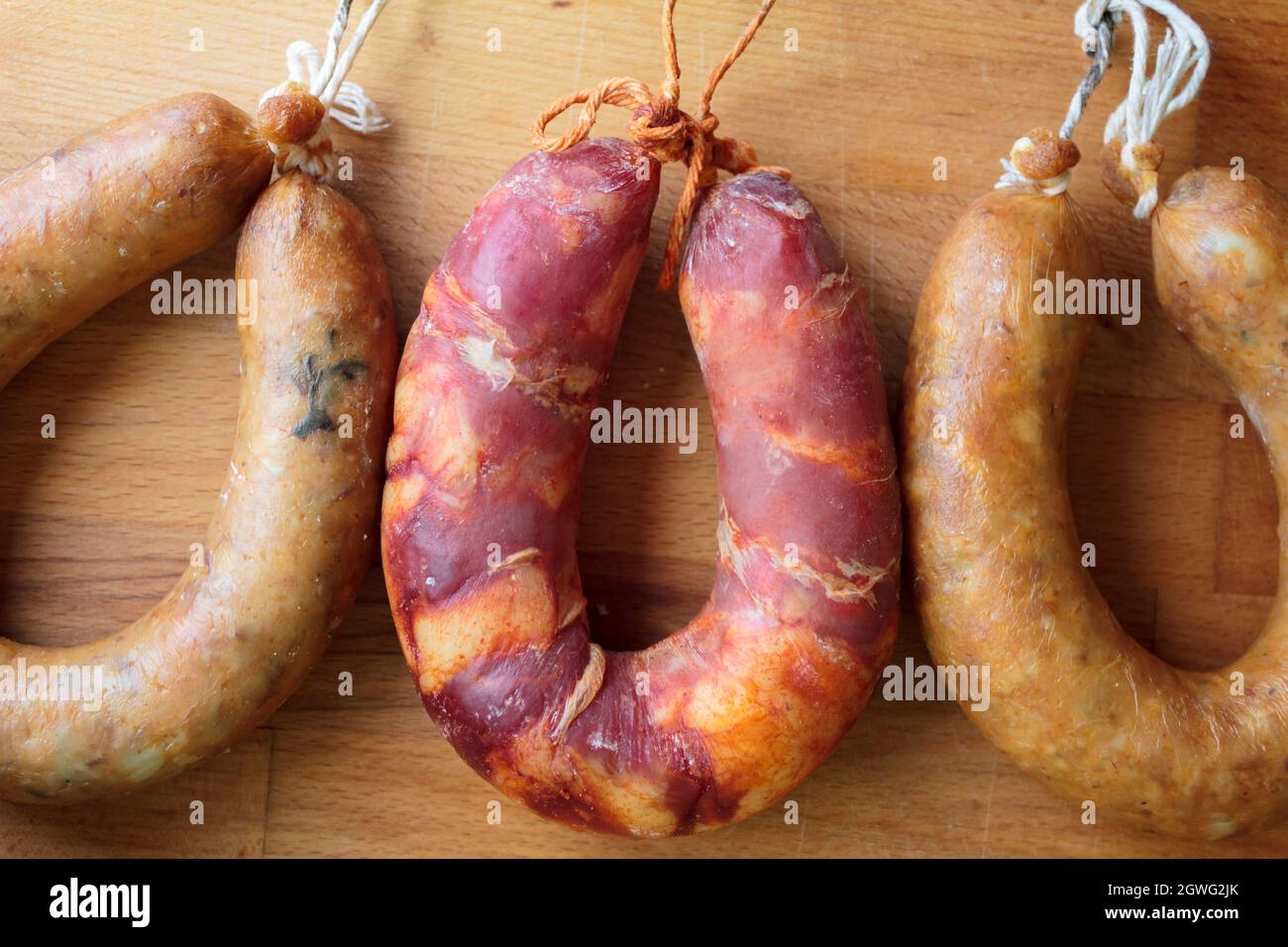 Portuguese Smoked Sausages, Alheira And Chorizo On Wooden Board Stock Photo