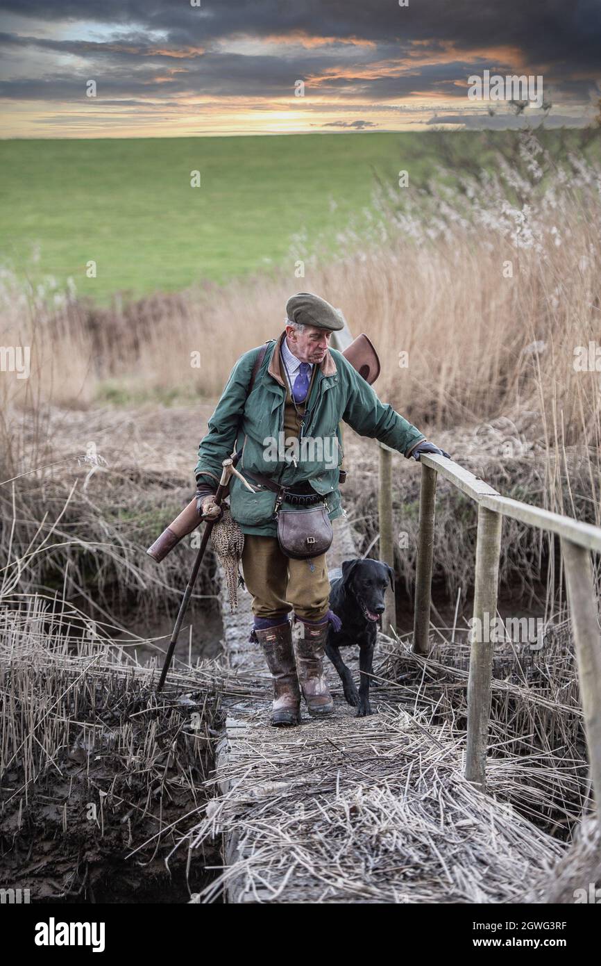 man coming home after a days pheasant shooting Stock Photo