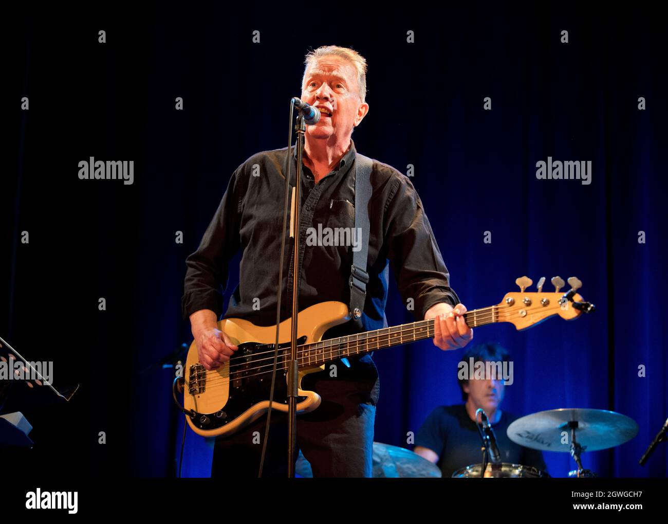 An early post-Covid 19 gig: Tom Robinson, in concert with his band, Victoria Hall, Settle, North Yorkshire, 30th September 2021 Stock Photo
