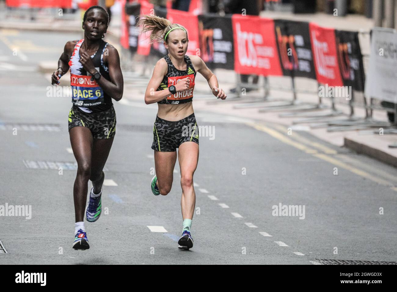 London, UK. 03rd Oct, 2021. British runner Charlotte Purdue at mile 19 in Canary Wharf. Following a 2-year absence, the Virgin Money London Marathon is back to its traditional course from Blackheath to the Mall. It is set to be the largest marathon staged anywhere, with over 40,000 participants, and a similar number completing the virtual marathon on a course of their choice simultaneously. Credit: Imageplotter/Alamy Live News Stock Photo