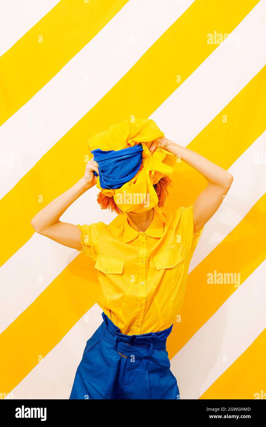 Sunny Fashion Girl On Trend Striped Yellow Background. Trends Colors Mixed Stock Photo