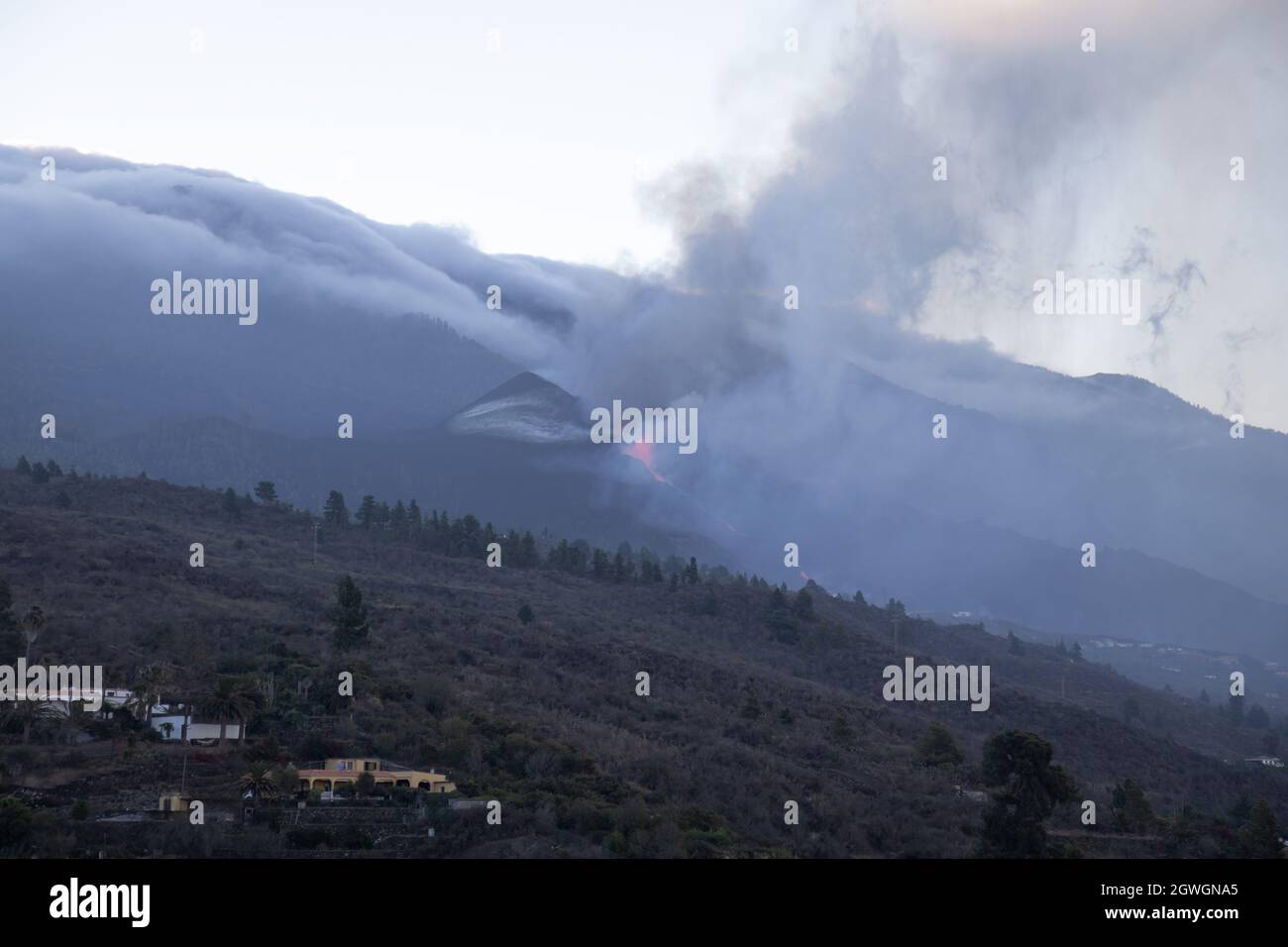 2021 Cumbre Vieja volcanic eruption (seen at morning from far) on the