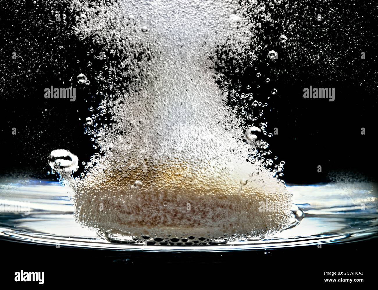 Effervescent tablets in water glass Stock Photo