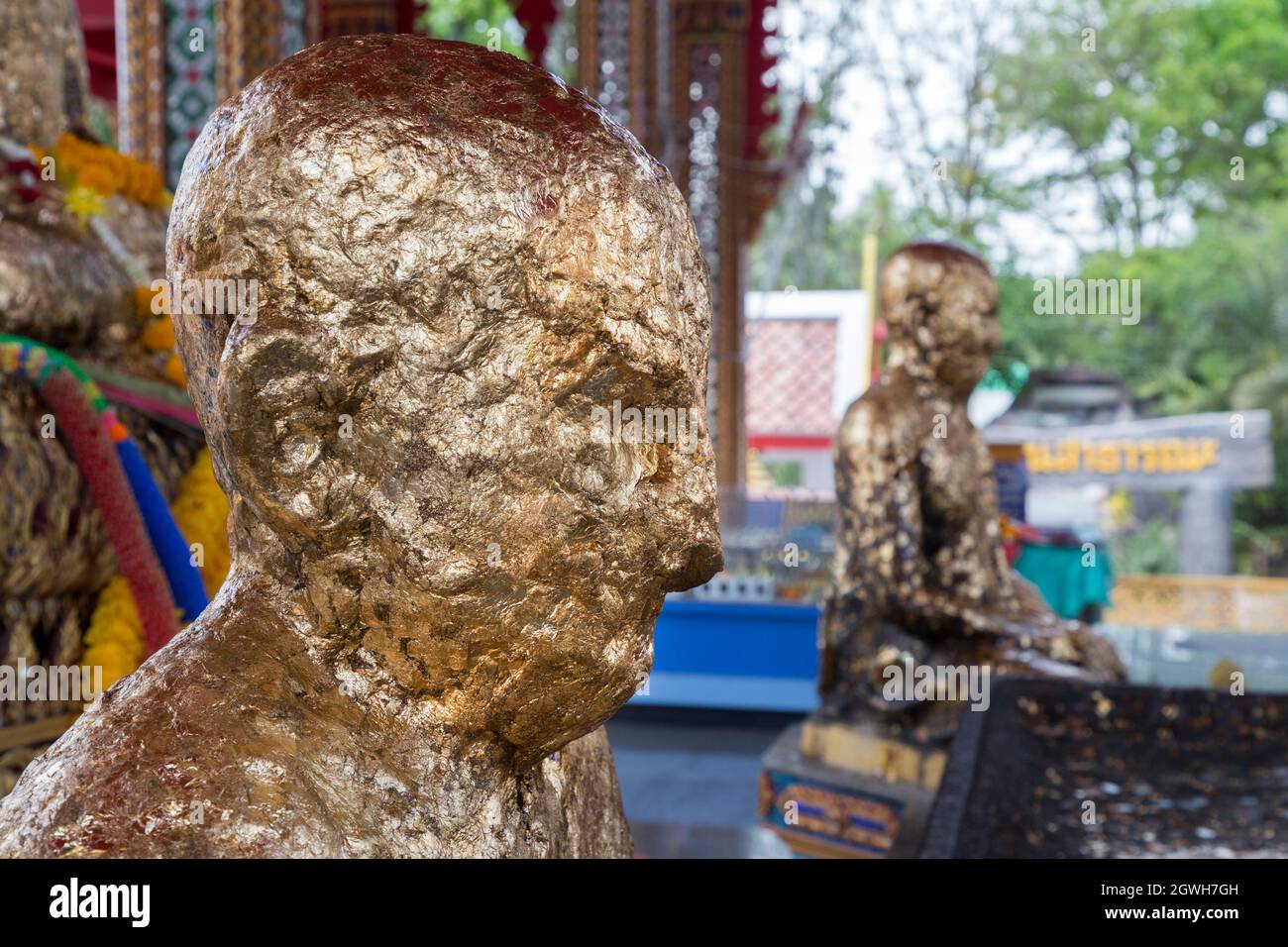 Buddah covered in gold leaf, Luang Poh Dang at Wat Prok Charoen, Bangkok, Thailand Stock Photo
