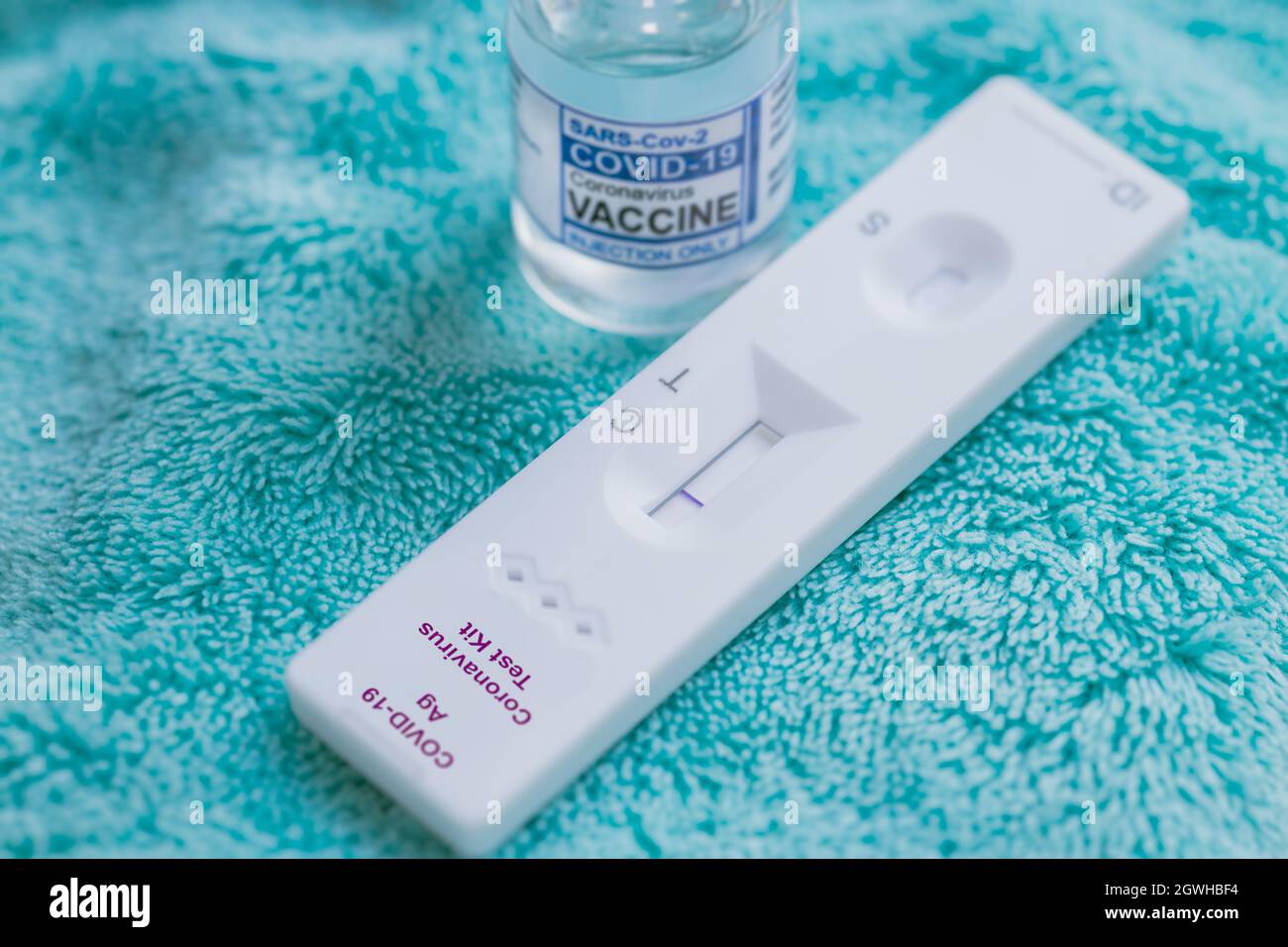 Covid-19 Self Rapid Antigen Test Kit with Covid Vaccine dose bottle for Coronavirus detect and treatment. Stock Photo