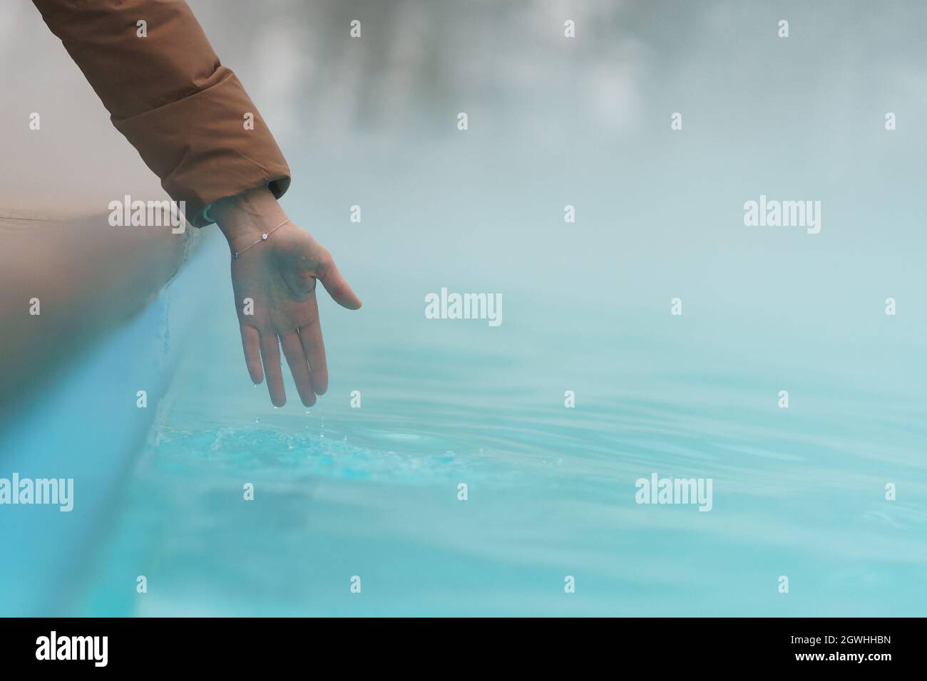Hand check temperature water hi-res stock photography and images - Alamy
