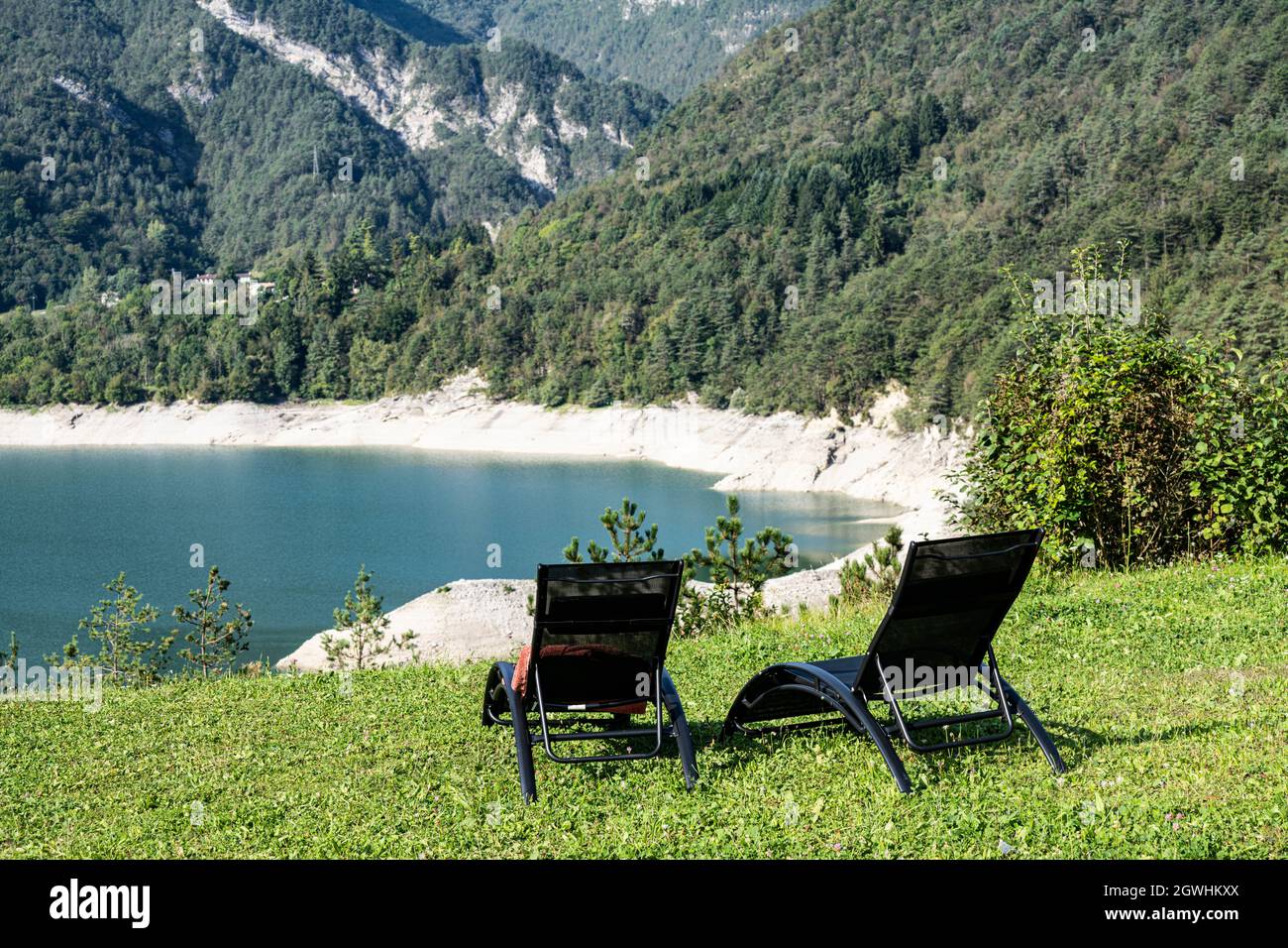 two deck chairs in the nature in front of a semi-dried lake Stock Photo ...