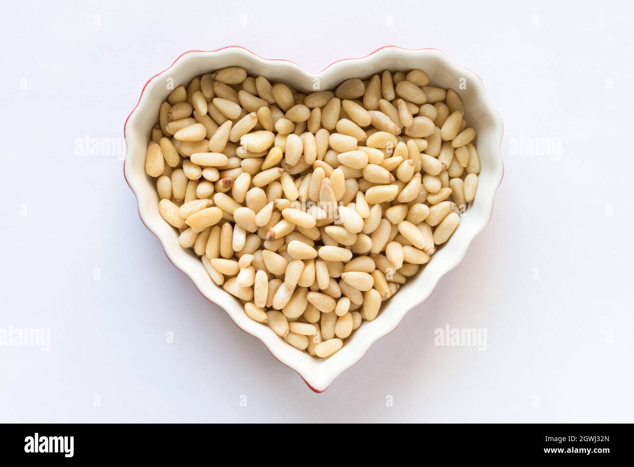 Pine Nuts In A Heart Shape Stock Photo
