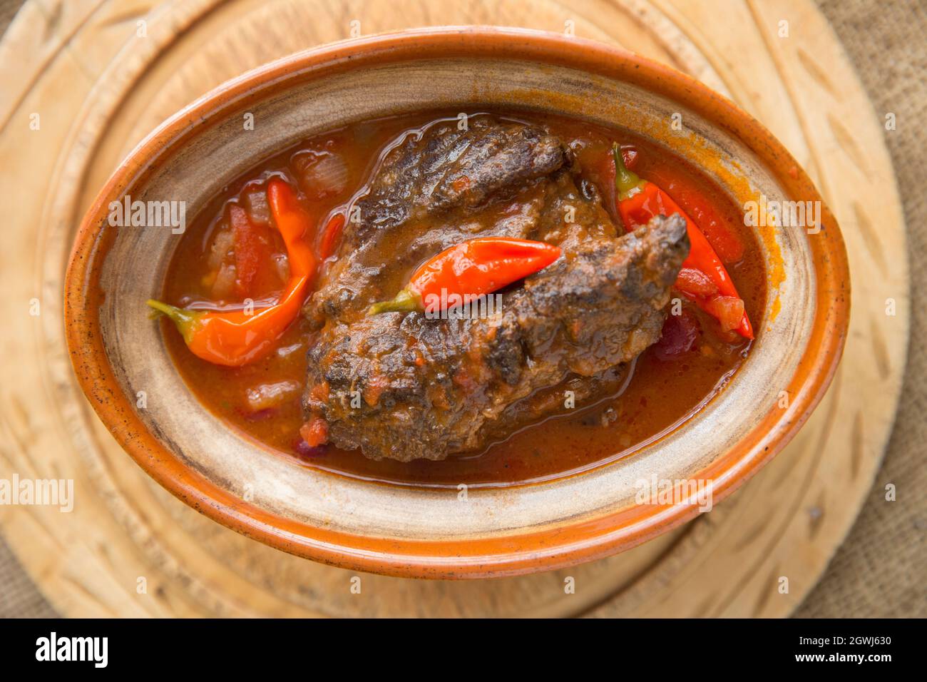 A stew made from slow cooked ox cheeks with vegetables, kidney beans and home grown chillies. England UK GB Stock Photo