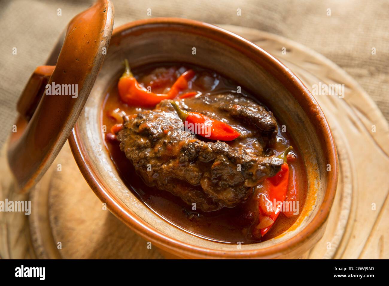 A stew made from slow cooked ox cheeks with vegetables, kidney beans and home grown chillies. England UK GB Stock Photo