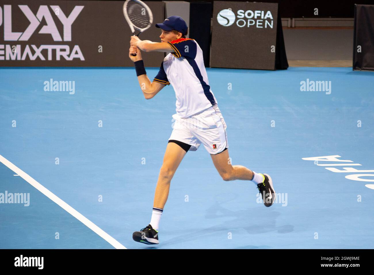 Jannik Sinner playing against Gael Monfils during the final of the Sofia Open 2021 ATP 250 indoor tennis tournament on hard courts Stock Photo