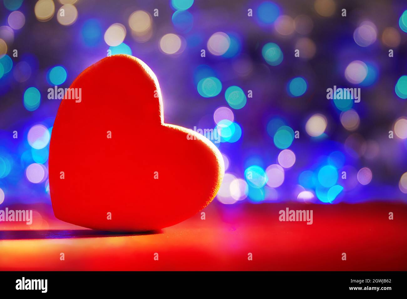 Greeting Card For Valentine's Day. Close-up Red Heart On Defocus Bokeh Blue  Background. Copyspace Stock Photo - Alamy