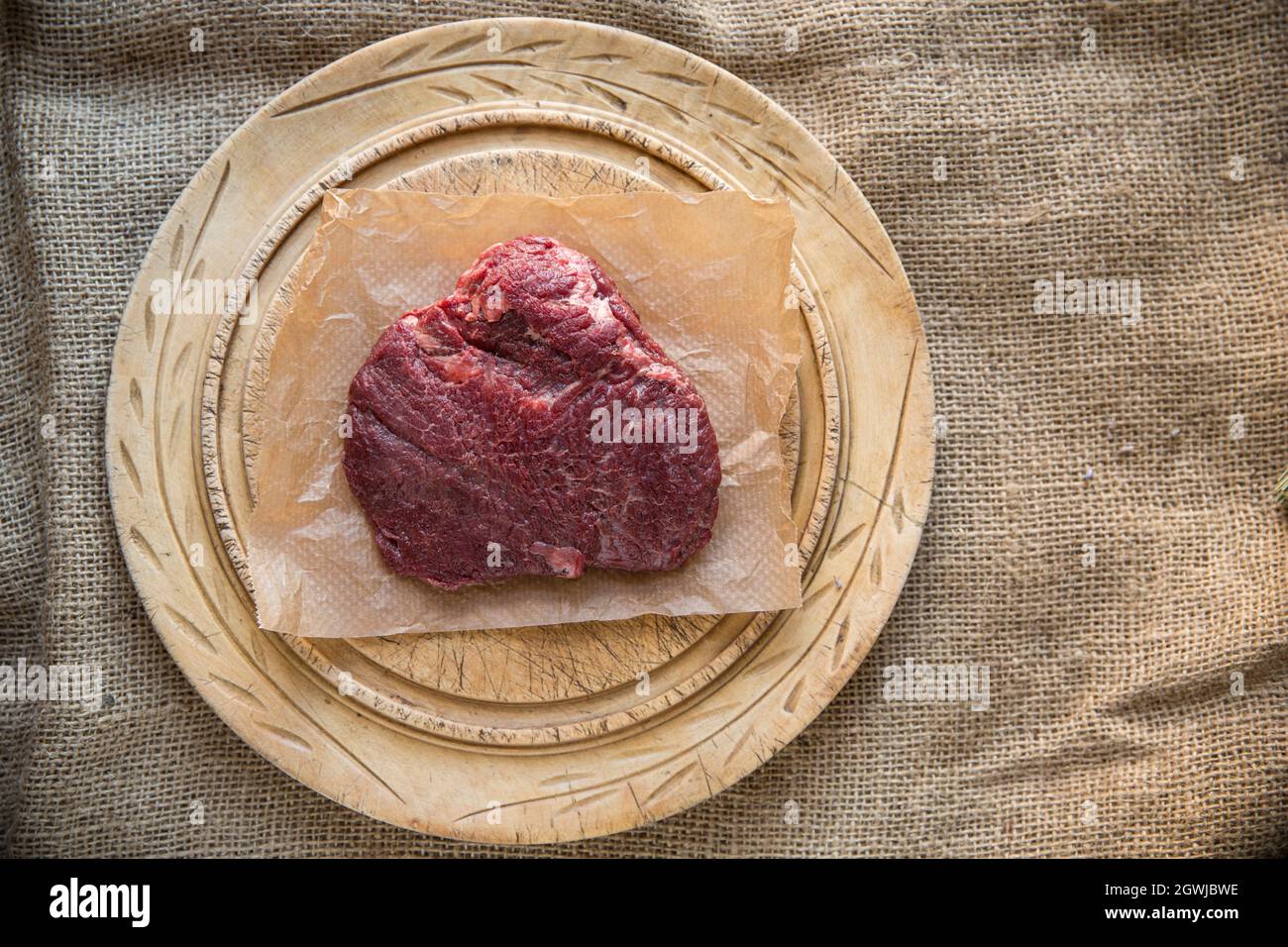 A raw, uncooked ox cheek bought from a supermarket in the UK. Ox cheeks have gained in popularity as an alternative cut of meat. England UK GB Stock Photo