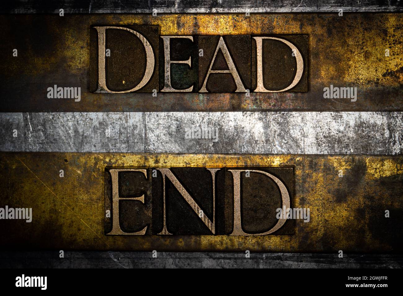 Dead End text on vintage textured grunge copper gold and silver background Stock Photo