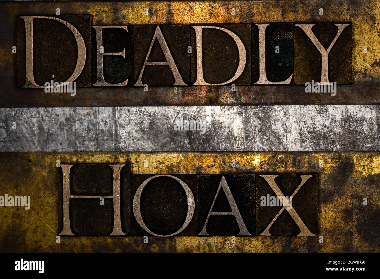 Deadly Hoax text on textured grunge copper and vintage gold background Stock Photo