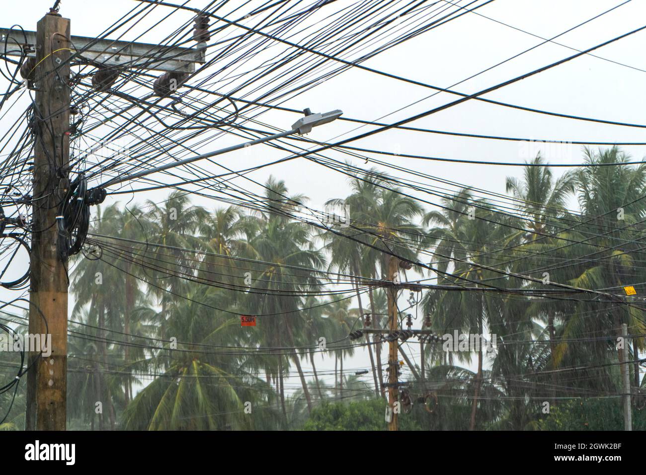 The Thai power lines between the poles in the Thai Village are famous Stock Photo Alamy