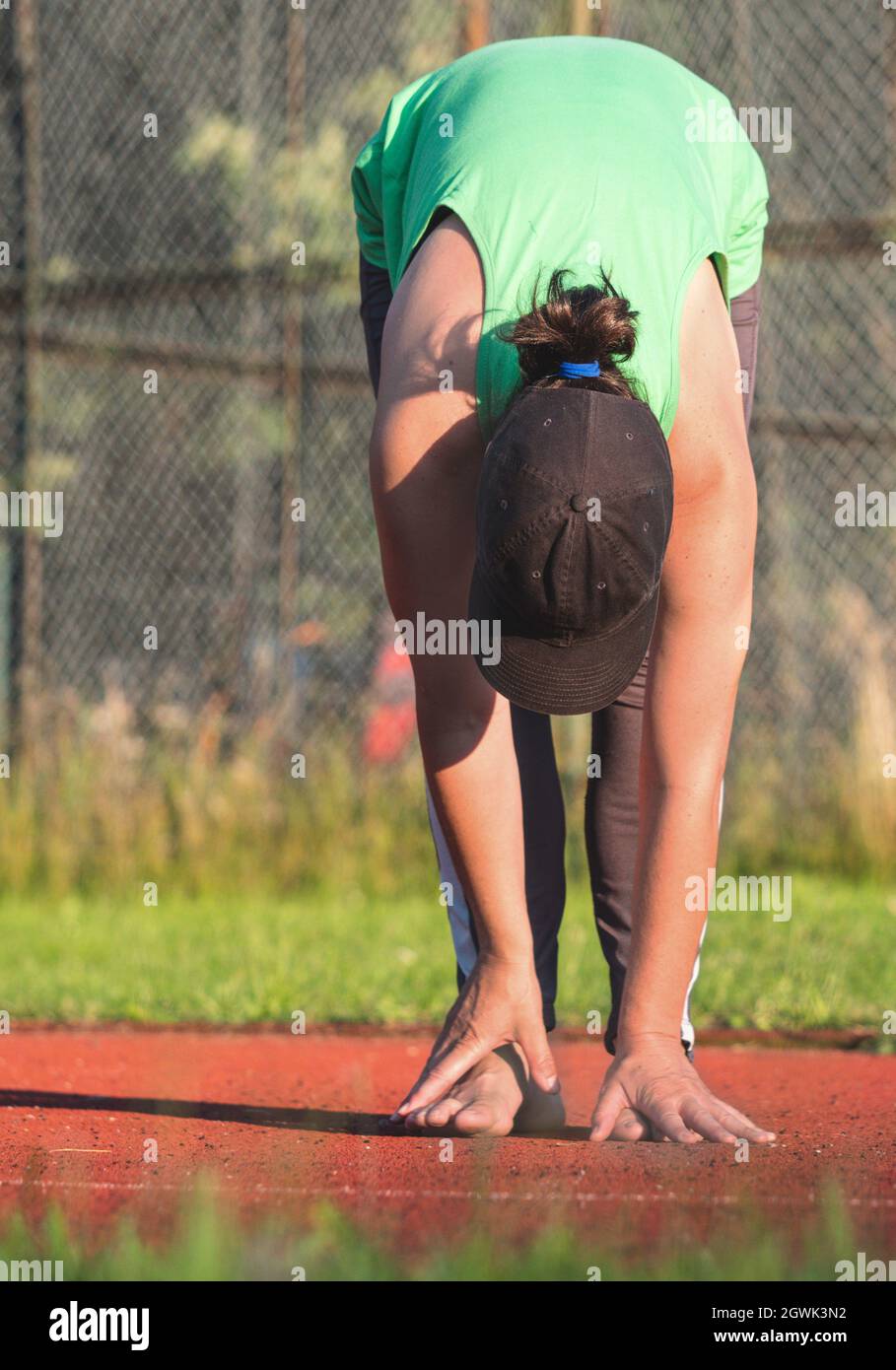 Female runner practise yoga and stretching body from back to legs cramp