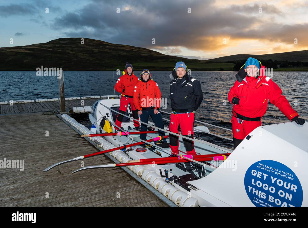 Men launch ocean rowing boat on Whiteadder Reservoir for a training session for Atlantic