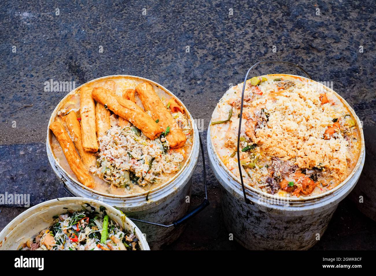 Three Buckets Of Slop Food Waste From A Vietnamese Restaurant. Pig Food