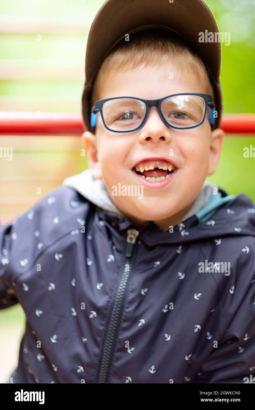 Funny Little Boy. Funny Boy With Glasses Laughs Carefree. He's In A Good  Mood Stock Photo - Alamy