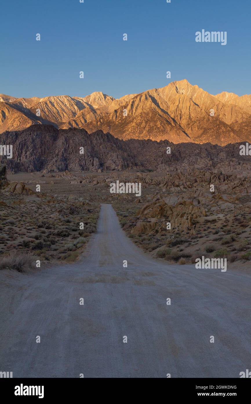 Movie Road In Alabama Hills Leading Into The Sierra Nevadas Lit By Brilliant Morning Sun Stock Photo