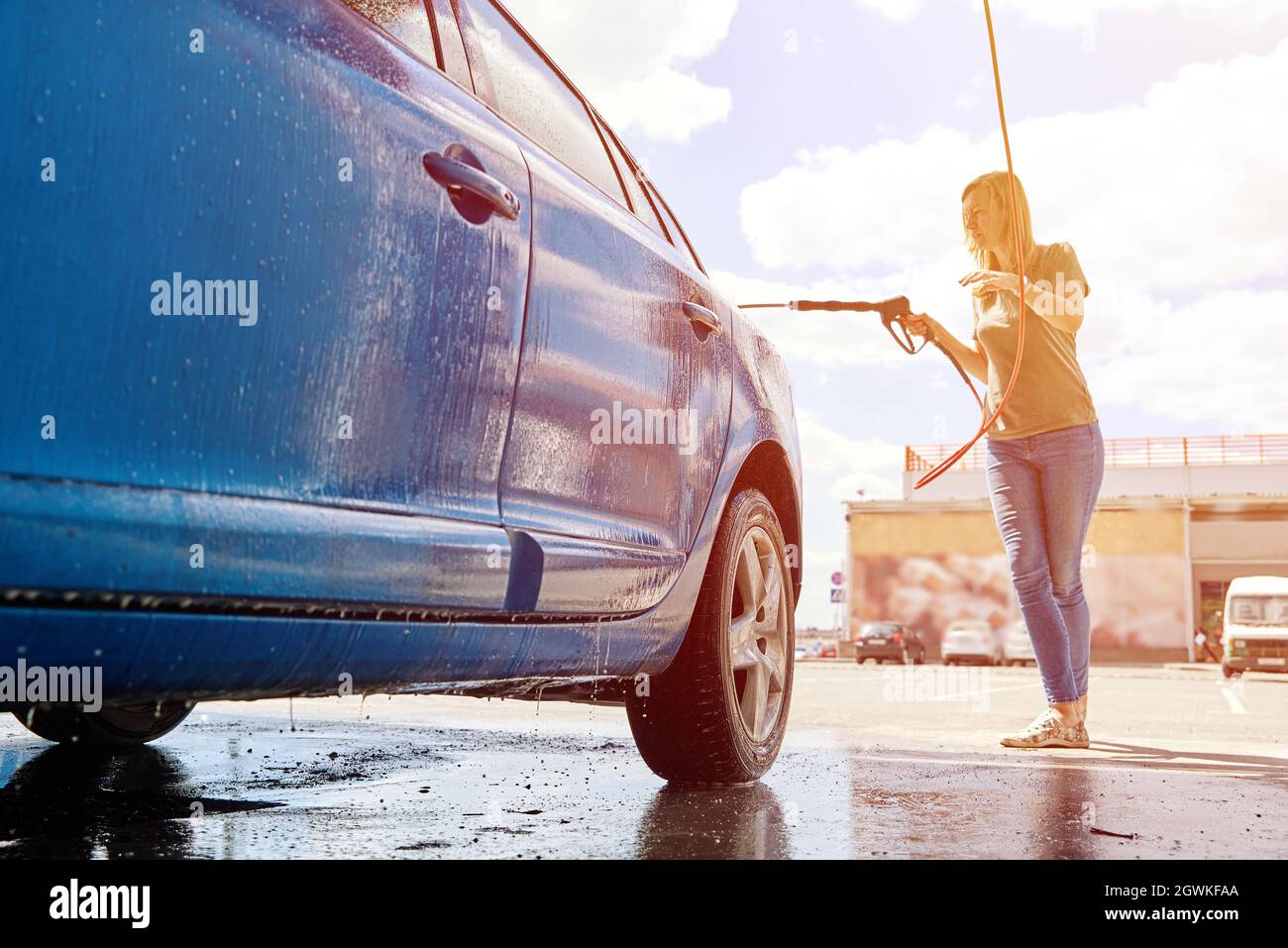 Car Washing.woman Cleaning Car With Contactless High Pressure Washing