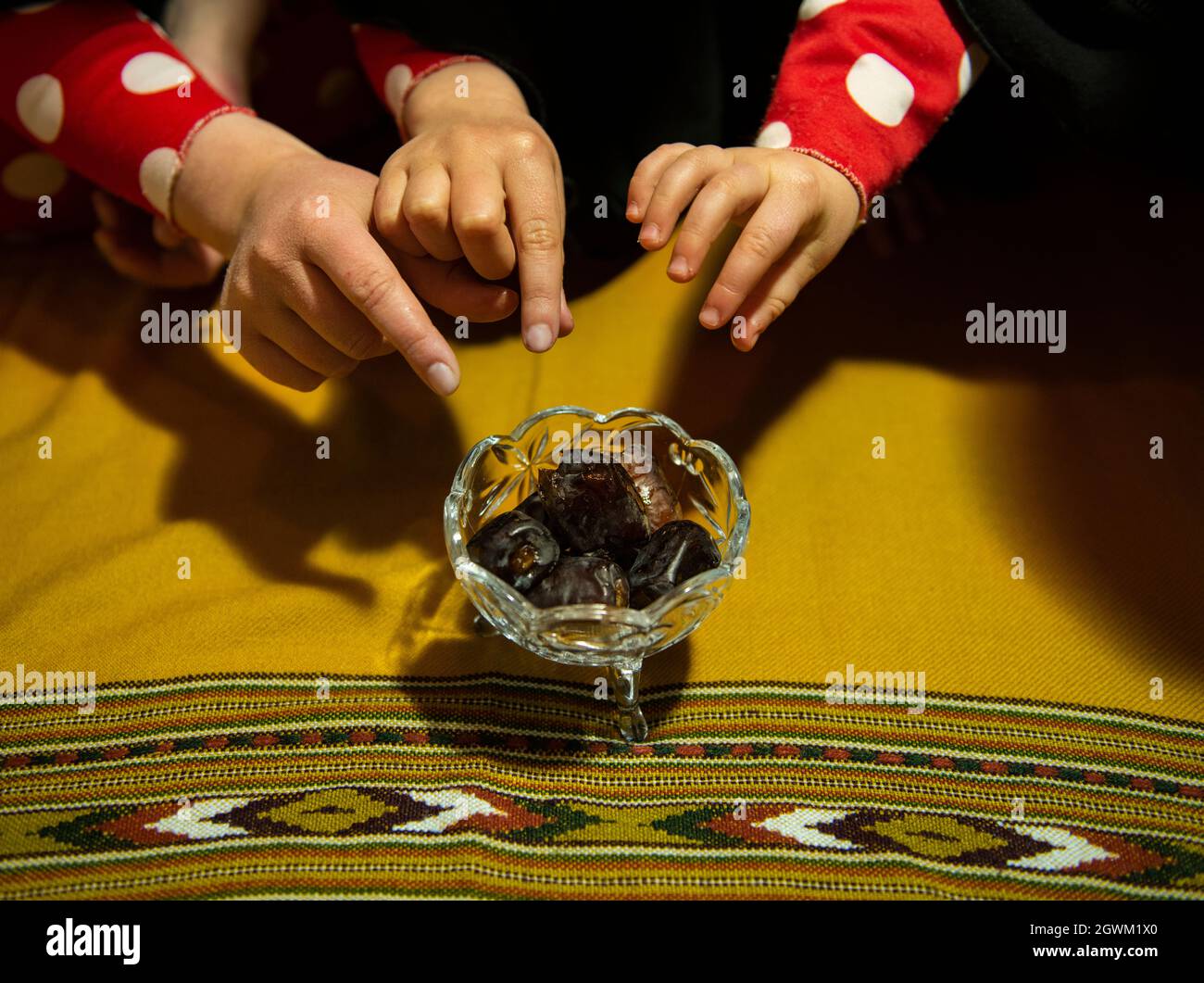 Kids Eating Dates For Ramadan Stock Photo Alamy